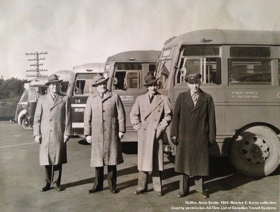 Company officials line up to be photographed, 1945